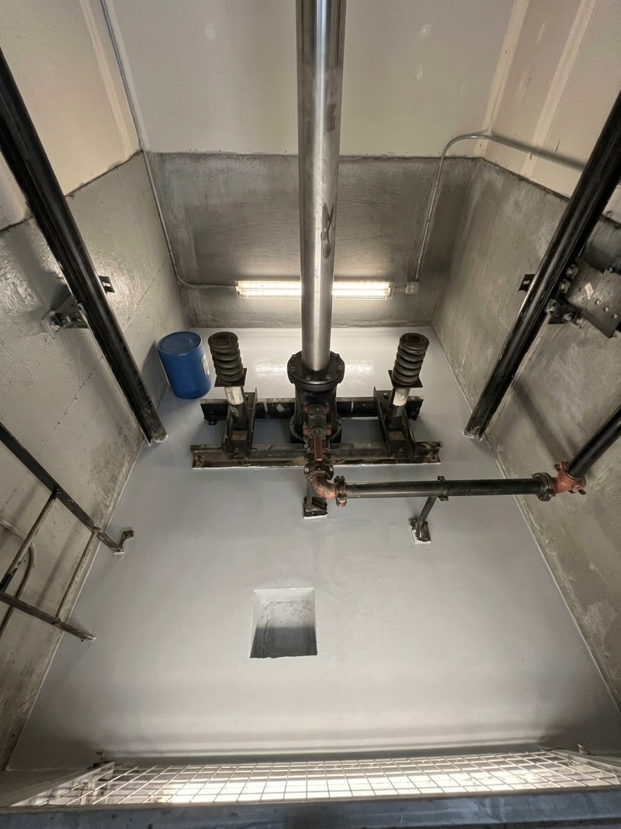 After documented treatment: elevator pit after sump-area concrete work and cold-joint treatment.
